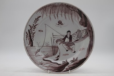 Lot 50 - An 18th century Delft charger, manganese...
