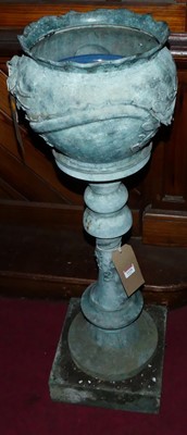 Lot 1124 - An Oriental verdigris copper jardiniere on...