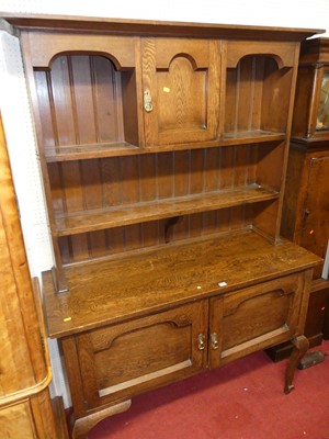 Lot 1134 - An early 20th century oak dresser, with...