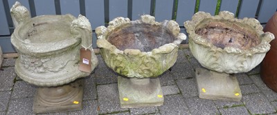 Lot 1153 - A pair of reconstituted stone pedestal garden...