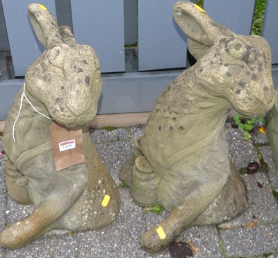Lot 1155 - A pair of reconstituted stone garden figures...