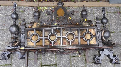 Lot 1157 - A black painted cast iron fire basket, with...