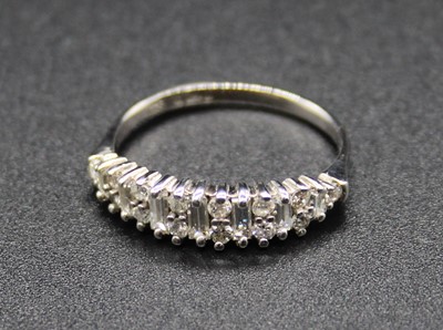 Lot 2755 - A modern 18ct white gold diamond half hoop...