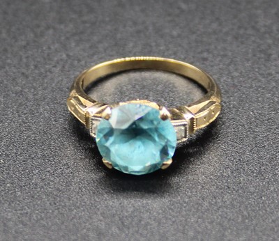 Lot 421 - A yellow metal, blue zircon and white sapphire...
