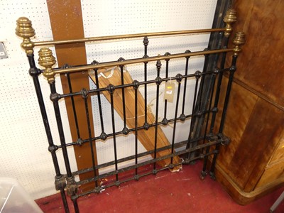 Lot 1136 - A Victorian brass and black painted wrought...
