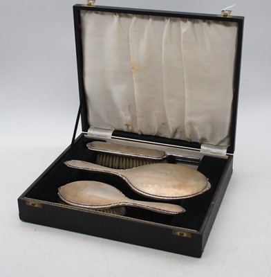 Lot 273 - An Elizabeth II cased silver three-piece...