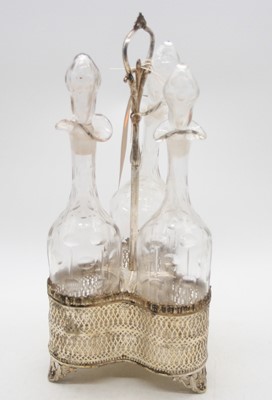Lot 282 - A pierced white metal triple decanter stand, h....