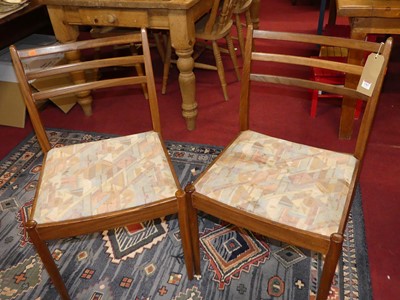 Lot 1363 - A set of four 1960s G-Plan teak ladder back...