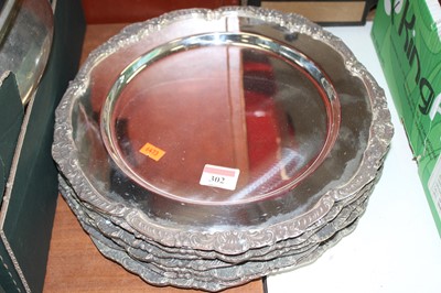 Lot 302 - A set of eight silver plated plates, dia.31cm