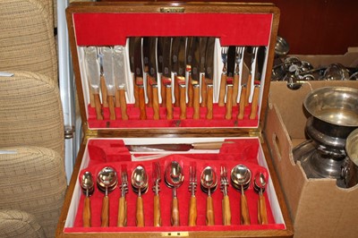 Lot 297 - A continental wooden handled canteen of flatware