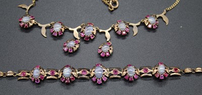 Lot 499 - A gilt metal cabochon moonstone and paste set...