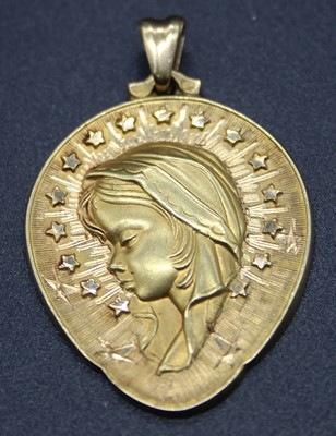 Lot 515 - A yellow metal pendant, relief cast with an...