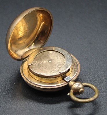 Lot 517 - A rolled gold sovereign case by Dennison