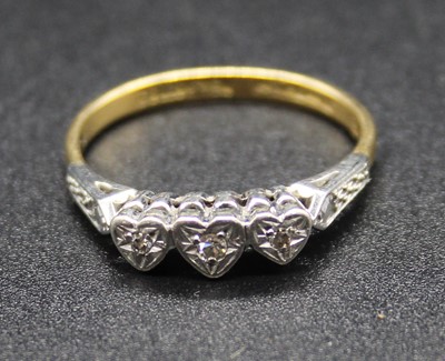 Lot 518 - An 18ct gold and platinum diamond three stone...