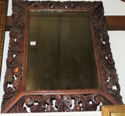 Lot 1004 - A Victorian carved oak framed wall mirror, 68...