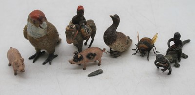 Lot 583 - A small collection of various painted figures...