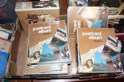 Lot 561 - A large collection of postcards, housed in six...