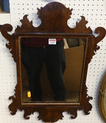 Lot 1145 - A Chippendale style mahogany fret cut wall...