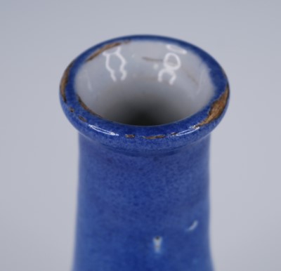 Lot 2073 - An English blue and white delftware bottle...