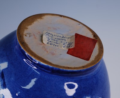 Lot 2073 - An English blue and white delftware bottle...