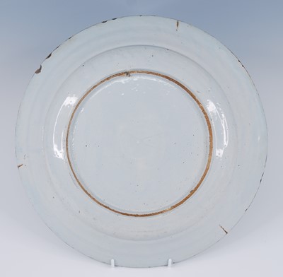 Lot 2103 - An English polychrome Delftware charger,...