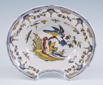 Lot 2127 - A French polychrome faience barber's shaving...