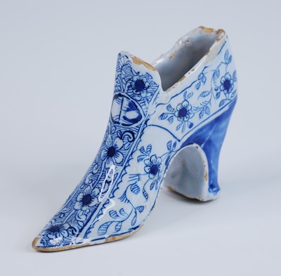 Lot 2078 - An English blue and white delftware shoe,...
