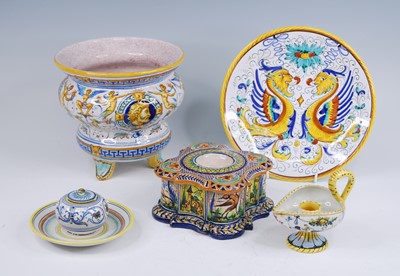 Lot 2129 - A French polychrome faience chamber stick,...