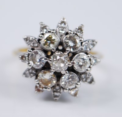 Lot 2679 - A yellow and white metal diamond flower shaped...