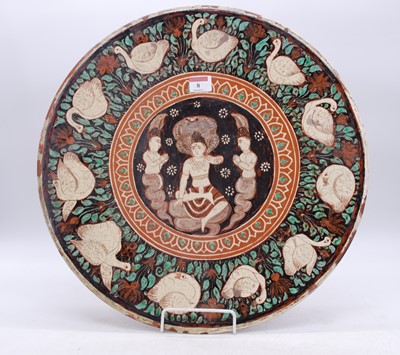 Lot 8 - An Eastern slip-glazed earthenware charger,...