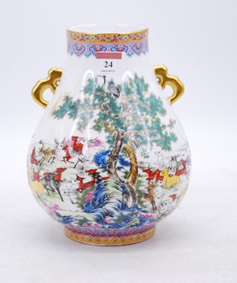 Lot 24 - A Chinese porcelain vase, of Hu form, enamel...