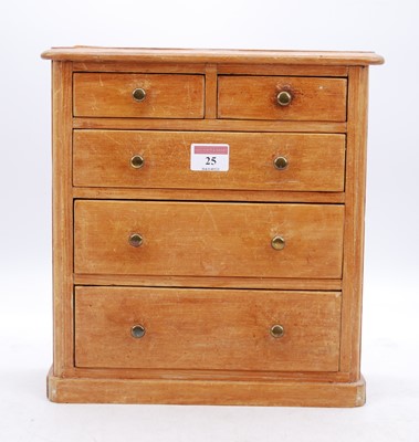Lot 25 - A Victorian pine apprentice chest, containing...