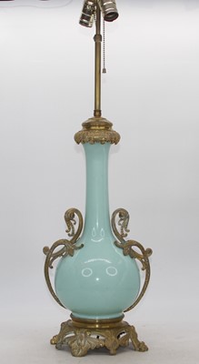 Lot 93 - A 20th century celadon glazed and brass...