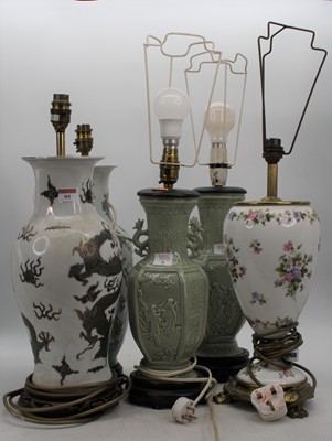 Lot 95 - A pair of Chinese celadon glazed table lamps,...