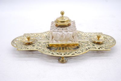 Lot 204 - A 19th century pierced brass inkwell, w.30cm