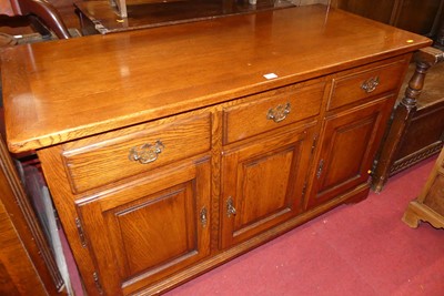 Lot 1232 - A contemporary joined oak sideboard, the three...