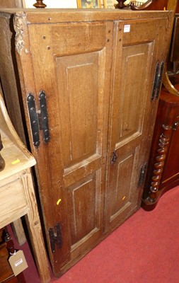 Lot 1262 - An antique joined oak double door twin...