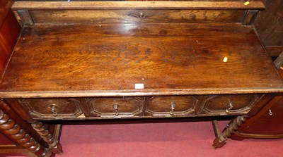 Lot 1267 - An early 20th century oak ledgeback side table,...