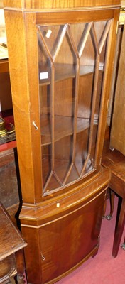 Lot 1269 - A reproduction mahogany corner cabinet, having...