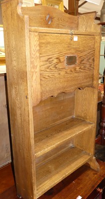 Lot 1270 - An early 20th century oak student's bureau,...