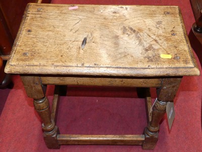 Lot 1286 - A joined oak joint stool, raised on turned and...