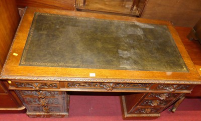 Lot 1294 - A circa 1900 relief carved oak 'Green Man'...