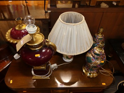 Lot 1313 - Two similar red glazed and gilt decorated...