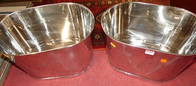 Lot 1325 - A pair of contemporary polished chromed metal...