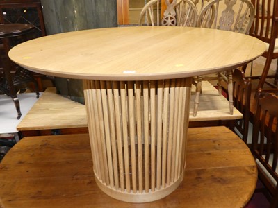 Lot 1370 - A contemporary light oak circular centre table...