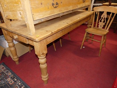 Lot 1375 - A pine round cornered farmhouse kitchen table,...