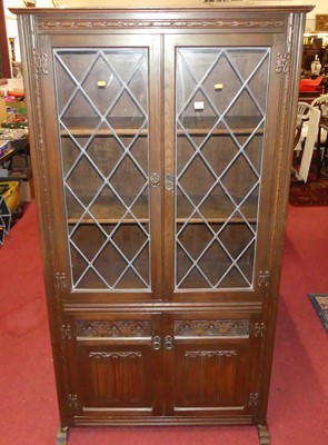 Lot 1381 - A contemporary Old Charm linenfold oak side...