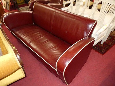 Lot 1385 - An Art Deco style two-piece bi-cast tan...