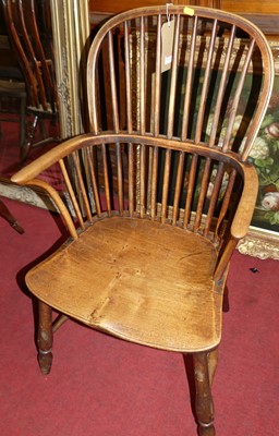 Lot 1410 - A 19th century elm and fruit wood Windsor...
