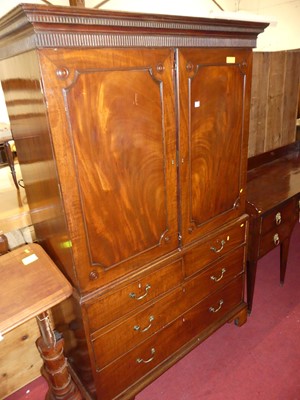 Lot 1420 - A Regency mahogany linen press, the twin...